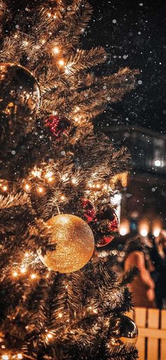 a christmas tree with lights and ornaments on it