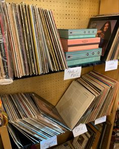 many records are stacked up on the shelves