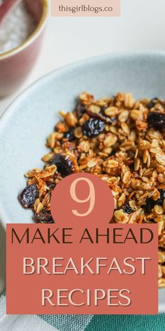 a bowl filled with granola and raisins on top of a table