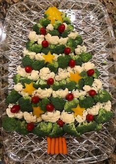 a christmas tree made out of broccoli and cauliflower on a glass platter