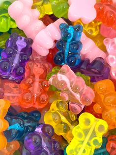 there are many different colored gummy bears together