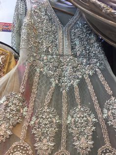 Heavy Wedding Dress In Beutiful Pinkish Gray Color.With Pure Dabka Crystals Nagh,Pearls Moti & Sequance Work.All Kind Of Heavy Bridal Dresses Are Available. Silver Party Dress With Intricate Embroidery, Bollywood Style Embellished Ceremony Dress, Silver Party Wear Dress For Wedding, Hand Embellished Anarkali Wedding Dress, Traditional Wedding Gown With Pearl Embroidery, Anarkali Wedding Dress Hand Embellished, Anarkali Hand Embellished Wedding Dress, Anarkali Hand Embellished Wedding Dress For Ceremony, Festive Silver Dress With Pearl Embroidery