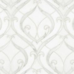 a white wallpaper with an intricate design on it