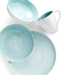 three blue and white dishes are stacked on top of each other, one is empty