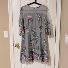 Cute Gray Dress With Floral Embroidery. Perfect For Wedding Or Evening Out. Festive A-line Dress With Floral Embroidery, A-line Wedding Dress With Intricate Embroidery, Elegant Embroidered A-line Evening Dress, Spring A-line Dress For Mother Of The Bride, Summer A-line Dress For Mother Of The Bride, Formal Floral Lace Applique Dresses, Formal Lace Dresses With Floral Applique, Spring Wedding Evening Dress With Floral Embroidery, A-line Wedding Dress With Floral Embroidery