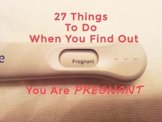 a remote control sitting on top of a table with the words, 27 things to do when you find out you are pregnant