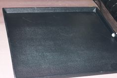 a black tray sitting on top of a counter