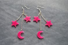 Dangle earrings with pink acrylic moon and star charms. Silver plated earring hooks with rubber backs Acrylic Moon and star charms For other colours and more celestial items  in my shop click here: https://www.etsy.com/uk/shop/InfiniteRoseDesigns?ref=seller-platform-mcnav&section_id=24328296 Thank you for visiting, for more items from InfiniteRoseDesigns, go to my shop: https://www.etsy.com/uk/shop/InfiniteRoseDesigns?ref=seller-platform-mcnav Acrylic Moon, Bird Skull Necklace, Raven Skull Necklace, Teen Necklaces, Kawaii Necklace, Stars Earrings, Goth Kawaii, Skeleton Earrings, Earrings Moon