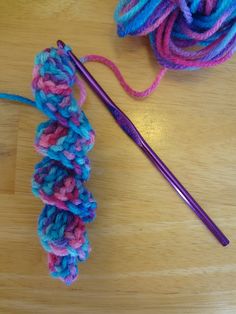 a crochet hook and yarn on a table