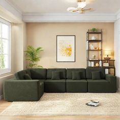 a living room with a large green couch