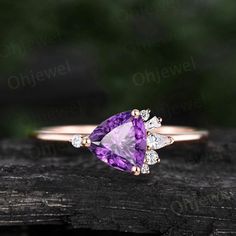 "This is a natural purple amethyst engagement ring in solid gold,about 6.5mm Trilliant cut.  The side stones are moissanites. It can be made in any ring size. However please contact me to custom make it to a special big or small size. It can be made in white gold,rose gold or yellow gold with 14k or 18k. However for some people who are nickel allergic,I can also make it to 925 sterling silver to make you can wear it. The ring is handmade,very high quality! 30 days money back guarantee. The ring set: https://www.etsy.com/listing/979029620/pear-shaped-moss-agate-engagement-ring Returns & Warranty 30-Day money back guarantee (starting from the day of delivery). \"Made to Order\" purchases qualify for our 30-day money back guarantee. The 30-day money back guarantee gives you time to make sure Dainty Purple Diamond Jewelry, Fine Jewelry With Brilliant Cut Amethyst, Fine Jewelry Amethyst With Brilliant Cut, Rose Gold Amethyst Jewelry With Halo Setting, Purple Amethyst Engagement Ring, Engagement Ring Cluster, Amethyst Ring Vintage, Amethyst Engagement Ring, Dainty Wedding