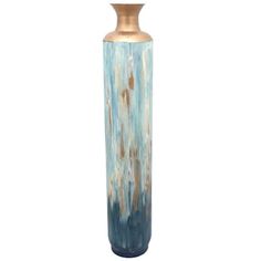 a tall blue vase sitting on top of a table