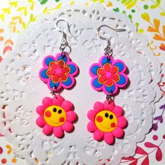 Daisy Pink Yellow Blue Hippie Flower Power Retro Costume Kidcore Earrings Handmade Earrings With Acrylic Charms And Glass Beads. These Measure 3" Inches Long 1" Wide . Nickel Free Sterling 925 Posts. Flowersfloralearrings #Daisyearrings #Retroearrings #Flowerpower #Hippie #Smileyface Smileface Peace Rave Futuristic Handmade Flowerearrings Kidcore Bright Halloween Cosplay Costume Kidcore Flower, Retro Multicolor Flower Jewelry, Kidcore Earrings, Retro Flower-shaped Earrings For Gift, Happy Rainbow Flower Earrings, Retro Yellow Flower Jewelry, Yellow Hypoallergenic Flower-shaped Earrings, Retro Costume, Hippie Flowers