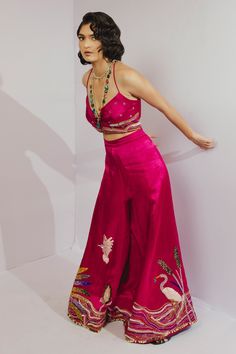 Pink wrap top with bead, geometric embroidery. Paired with bird embroidered pant.
Component: 2
Pattern: Embroidery
Type Of Work: Geometric, bird
Neckline: V neck
Sleeve Type: Sleeveless
Fabric: Gajji silk
Color: Pink
Other Details: 
Wrap around top
Flared pant
Note: Necklace worn by the model is not for sale
Occasion: Sangeet - Aza Fashions Traditional Embellished Sleeveless Palazzo Set, Sleeveless Silk Sequin Sets, Bohemian Sleeveless Embellished Sets, Sleeveless Bohemian Embellished Sets, Bohemian Embellished Sleeveless Sets, Sleeveless Palazzo Set With Intricate Embroidery For Party, Bollywood Style Sleeveless Hand Embellished Sets, Bollywood Hand Embellished Sleeveless Sets, Embellished Sleeveless Choli