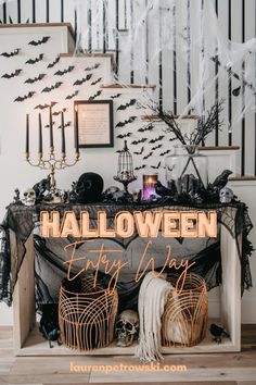 Scary Halloween entry way decorations using bats, skulls, birds and spiderwebs Halloween Decorations Entry Table, Decorate Halloween Party, Front Entry Halloween Decorations, Halloween Entry Table Decor Ideas, Halloween Entry Way Table, Halloween Console Table Decor Ideas, Decorate For Halloween Party, How To Decorate Your House For Halloween, Banister Halloween Decor