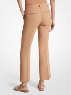 Our coveted Haylee trousers return with a seasonal update for spring. Crafted in Italy from double crepe sablé, this elevated pair is sharply tailored with flared legs and an above-the-ankle hem to create a streamlined silhouette. Finished with side pockets and crisp pleats down the front, they look especially chic paired with sleek sandals and a cashmere sweater or blazer. Spring Wide Leg Work Pants In Elastane, Spring Office Elastane Pants, Spring Office Dress Pants With Pressed Crease, Chic Bottoms With Pressed Crease For Spring, Chic Spring Bottoms With Pressed Crease, Tailored Bottoms With Pressed Crease For Spring, Fitted Elastane Dress Pants For Spring, Chic Spring Dress Pants With Pressed Crease, Spring Workwear Pants With Pressed Crease