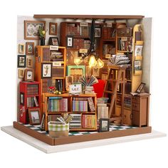 a doll house with furniture and bookshelves in it