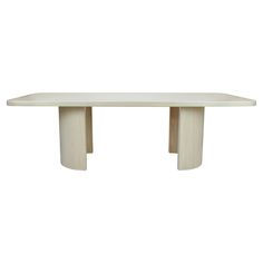 a white table with two wooden legs