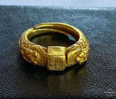 "Offered is a very old and quite rare Chinese 24k double Dragon Ring. Pre 18th century...probably Ming Dynasty. Hand carved with finely detailed double dragons and chinese calligraphy on the ring as well as on the shank. This ring has been in a case for well over 40 years, I have rarely handled it, in order to avoid causing further wear to the dragons and other details. An incredible piece of Chinese history. Weight 7.8g Metal - 24k High Karat Gold (verified) Hallmarks - Chinese Characters insid Antique Engraved Open Ring For Ceremonial Occasions, Gold Vintage Jewelry For Formal Occasions, Gold Byzantine Carved Jewelry, Ceremonial Engraved Open Ring With Hallmark, Ancient Yellow Gold Jewelry For Ceremonial Occasions, Ancient Style Yellow Gold Ceremonial Jewelry, Ancient Style Yellow Gold Jewelry For Ceremonial Occasions, Antique Carved Engraved Ring For Ceremonial Use, Antique Open Ring For Ceremonial Occasions