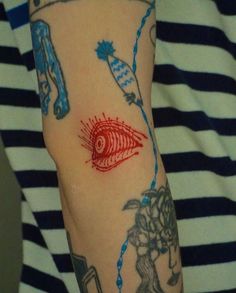 a person with tattoos on their arms and arm