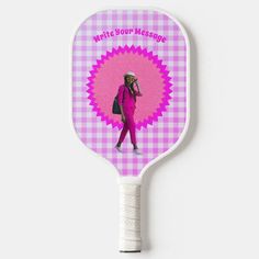 a pink and white racket with a woman's face on the back of it