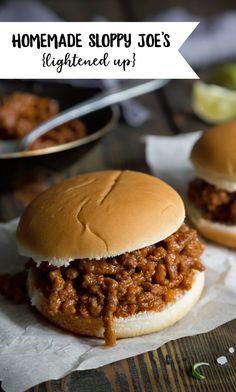 two sloppy joe's sandwiches on wax paper with limes in the background and text overlay that reads homemade sloppy joe's lightened up