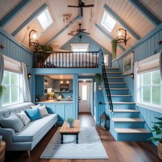 a living room filled with furniture and a staircase leading up to the top story window