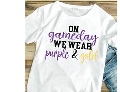 Comfy shirt for Saturday football lounging!  Pick your school colors! Shirts are 100% cotton. Please note that colors on your shirt may slightly vary from colors on your computer screen.   Care instructions: Wash cold, inside out. Do not use bleach.  Hang to dry. Purple College T-shirt With Team Name, Game Day School Spirit T-shirt With Heat Transfer Vinyl, Purple T-shirt With Team Name For Campus Wear, White T-shirt With Heat Transfer Vinyl For Game Day, Collegiate Purple Top For Game Day, Purple Cotton T-shirt For Game Day, Purple Sporty T-shirt For Game Day, Basketball T Shirt, Football T Shirt