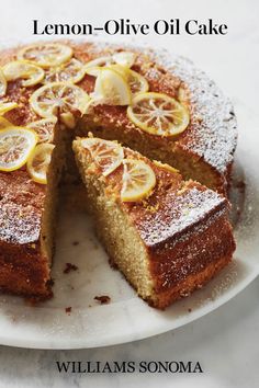 a lemon - olive oil cake on a white plate