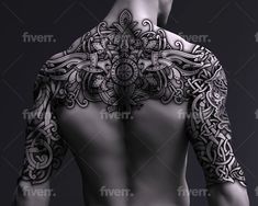 the back of a man's body covered in tattoos