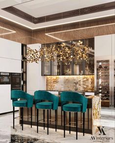 a modern kitchen with gold accents and green chairs