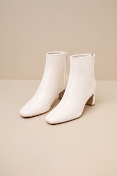 'Tis the season for falling leaves, cozy cardigans, and the Lulus Oceane Off White Ankle Booties! Smooth faux leather shapes these wardrobe-essential booties with a squared, pointed-toe upper and a seamed design. The ankle-high shaft boasts a 4.25"" pull-tab zipper at the heel for easy on-and-off, all atop a stylish blade heel. Available in whole sizes only. 2. 75" wrapped blade heel. Cushioned insole. Rubber sole has nonskid markings. Man Made Materials. Imported. Lulus | Oceane Off White Ankle Spring Booties With Padded Ankle And Medium Width, Medium Width Heeled Boots For Fall, Winter Ankle Booties Medium Width, Fall Medium Width Faux Leather Booties, High Heel Faux Leather Fall Booties, Fitted Ankle Booties With Padded Ankle, Fall Boots With Padded Ankle And Block Heel, Fall High Heel Faux Leather Booties, Fall Medium Width Ankle Heeled Boots