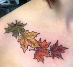 a woman's chest with leaves on it