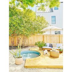 an outdoor hot tub in the middle of a wooden deck