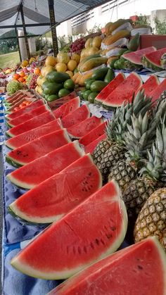 watermelon, pineapples and other fruits are on display