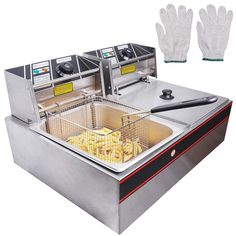 a fryer with some food in it and two gloves on the counter next to it