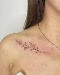 a woman with a tattoo on her chest