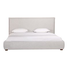 a bed with white linens and pillows on it's headboard, in front of a white background