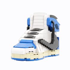 a lego model of a space ship with stairs on the front and side, in blue and white