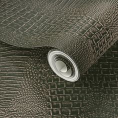 an up close view of a leather textured wallpaper in black and grey tones