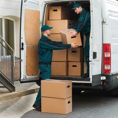 two men unloading boxes from the back of a van