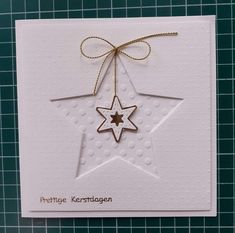 a white card with a star hanging from it