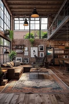 an industrial living room with exposed brick walls and wood flooring is furnished with modern furniture