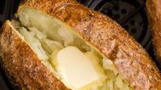 two pieces of bread sitting on top of an open air fryer with cheese in it