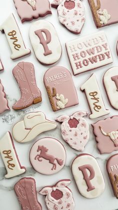 pink and white decorated cookies with the letter p on them