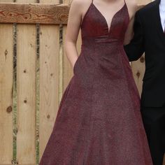 Great Condition. Size 6 Dress By Tiffany. The Color Is Burgandy -Wine Its Simmery - (Zoom In On Photos) It Has Pockets On Both Sides And Lace Up In Back. Only Worn Once. Person In Picture Wearing Dress Is 5'9" There Is A Slight Piece Of Skin Tone Mess In Front So It Is Not Open As Far Dwon As It Appears (Se Photos) That Can Be Stiched Up To Close More If Needed. Dress With Pockets, Homecoming Dress, Wearing Dress, Skin Tone, Tiffany & Co., Color Purple, Homecoming Dresses, Homecoming, Prom