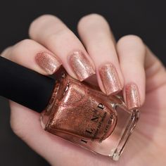 Chelsea is a supremely elegant pale rose gold holographic polish with a buttery smooth and reflective finish.  Certain to be a favorite, Chelsea is the upscale darling you’ve been waiting for. The intense metallic shine coupled with a very precise holographic accent make this polish something truly special and balanced.  If you’ve been searching for a refined and mature pale rose gold, this is it! Guaranteed to impress!  Chelsea is part of ILNP’s Ultra Metallics® class of incredibly vivid metall Gold Holographic Nails, Ilnp Nail Polish, Rose Gold Nail Polish, Boutique Nails, Glitter Accessories, Glitter Accent Nails, Metallic Nail, Metallic Nail Polish, Gold Nail Polish