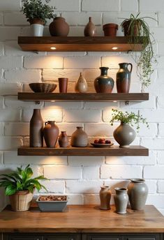 some shelves with pots and vases on them