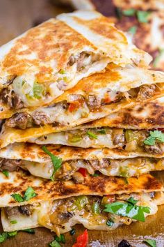 Philly Cheesesteak Quesadillas are filled with beef and melted cheese in a toasted tortillaAn easymake-ahead quesadilla recipe done in under 30 minutes. Philly Cheesesteak Quesadilla, Cheesesteak Quesadilla, Toasted Tortilla, Mushrooms And Onions, Quesadilla Recipe, Cheese Quesadilla, Shredded Chicken Recipes, Cheese Steak