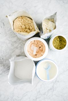 four bowls with different types of food in them